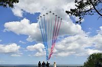 (From L) US First Lady Melania Trump, US President Donald Trump, French President Emmanuel Macron and French President's wife Brigitte Macron watch as French elite acrobatic flying team "Patrouille de France" (PAF) fly over after a French-US ceremony at the Normandy American Cemetery and Memorial in Colleville-sur-Mer, Normandy, northwestern France, on June 6, 2019, as part of D-Day commemorations marking the 75th anniversary of the World War II Allied landings in Normandy. (Photo by MANDEL NGAN / AFP)