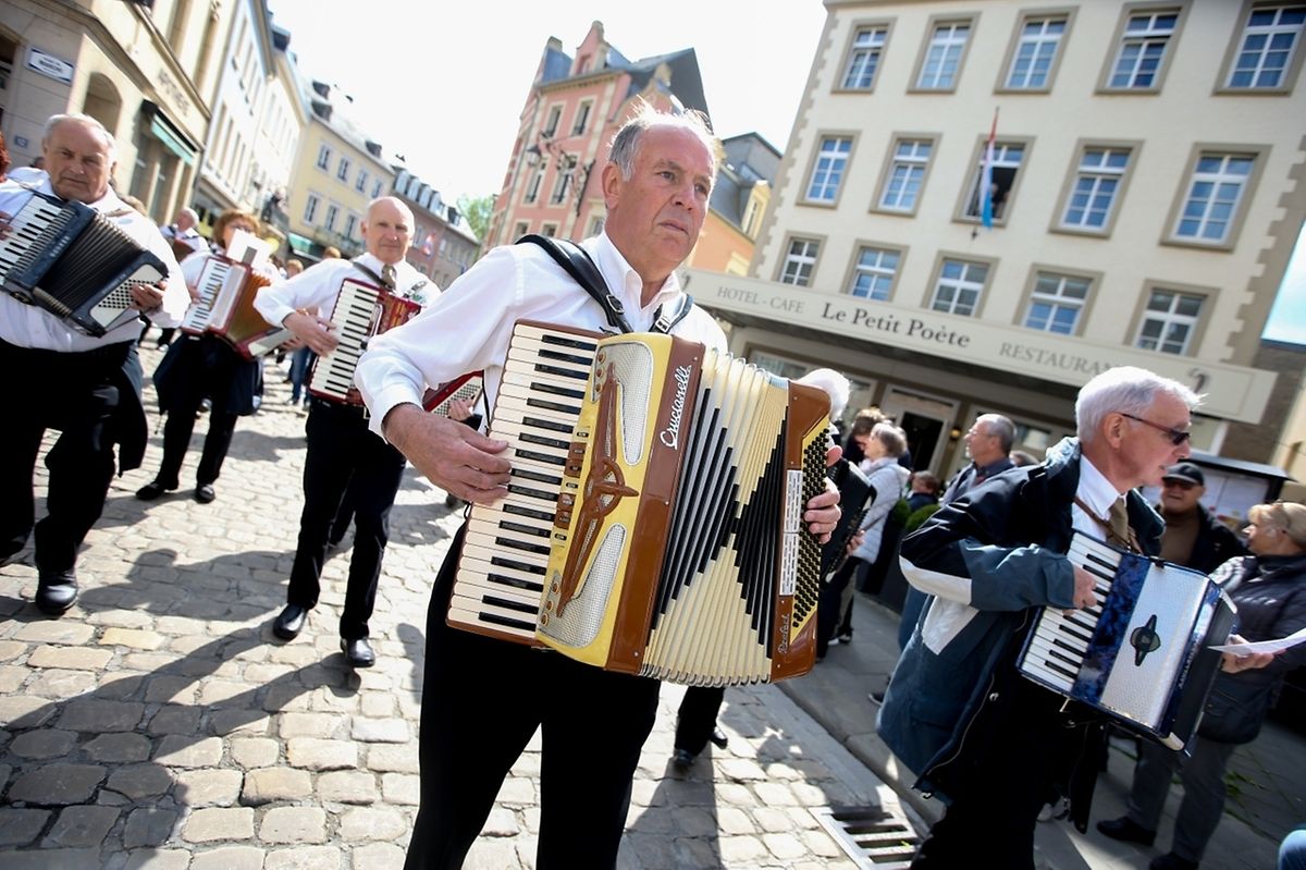 Accordian players accompany the procession 