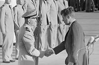 John Kennedy gives William Ekhart the Presidential Unit Citation for photographing missile installations in Cuba during the Cuba Crisis.