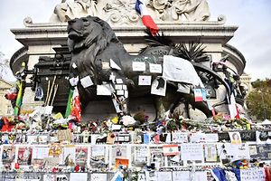 A picture shows a makeshift memorial for the victims of the attacks claimed by Islamic State on November 16, 2015 at the Place de la Republique in Paris. France and other countries in Europe held a minute's silence in memory of the victims of the worst ever terror attacks on French soil. AFP PHOTO / LOIC VENANCE
