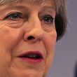 Britain's Prime Minister Theresa May addresses delegates at the annual Confederation of British Industry (CBI) conference in east London, on November 6, 2017. / AFP PHOTO / Daniel LEAL-OLIVAS