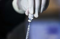 DENVER, CO - JANUARY 30: Pharmacy technicians prepare doses of the Pfizer-BioNTech vaccine at a mass COVID-19 vaccination event on January 30, 2021 in Denver, Colorado. UCHealth, Colorado's largest healthcare provider, plans to vaccinate 10,000 seniors over 70 during the drive-up event this weekend.   Michael Ciaglo/Getty Images/AFP
== FOR NEWSPAPERS, INTERNET, TELCOS & TELEVISION USE ONLY ==