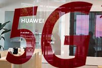 (FILES) This file photo taken on May 25, 2020, shop for Chinese telecom giant Huawei features a red sticker reading "5G" in Beijing on May 25, 2020. - China's Huawei is not totally banned from France's next-generation 5G wireless market, but French operators using them will only get limited licences, the head of the national cybersecurity agency told Les Echos newspaper on July 6, 2020. (Photo by NICOLAS ASFOURI / AFP)