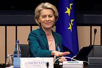 European Commission President Ursula von der Leyen rings a bell to mark the start of a meeting of the commission at the European Parliament in Strasbourg, on April 5, 2022. (Photo by Ronald WITTEK / POOL / AFP)