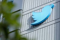 The Twitter logo is seen on a sign on the exterior of Twitter headquarters in San Francisco, California, on October 28, 2022. - After months of controversy, Elon Musk is now at the head of one of the most influential social networks on the planet, whose "tremendous potential" he has promised to unleash. (Photo by Constanza HEVIA / AFP)