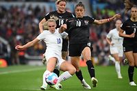England's midfielder Georgia Stanway (L) vies with Austria's midfielder Laura Feiersinger (C) during the UEFA Women's Euro 2022 Group A football match between England and Austria at Old Trafford in Manchester, north-west England on July 6, 2022. (Photo by FRANCK FIFE / AFP) / No use as moving pictures or quasi-video streaming.  Photos must therefore be posted with an interval of at least 20 seconds.