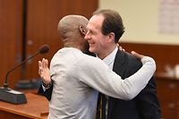 Dewayne Johnson (L) hugs one of his attorneys after the verdict was read in the case against Monsanto at the Superior Court Of California in San Francisco, California on August 10, 2018. - A California jury on Friday, August 10, 2018 ordered agrochemical giant Monsanto to pay nearly $290 million for failing to warn a dying groundskeeper that its weed killer Roundup might cause cancer. Jurors found Monsanto acted with "malice" and that its weed killers Roundup and the professional grade version RangerPro contributed "substantially" to Dewayne Johnson's terminal illness. (Photo by JOSH EDELSON / AFP)