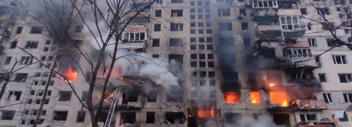 TOPSHOT - In this handout picture taken and released by the State Emergency Service of Ukraine on March 14, 2022, firemen work to extinguish a fire in an apartment building hit by shelling in the Obolon district of Kyiv. - A Russian air strike on a residential building in Kyiv killed one and wounded several others, Ukrainian emergency services said on March 14. (Photo by State Emergency Service of Ukraine / AFP) / RESTRICTED TO EDITORIAL USE - MANDATORY CREDIT "AFP PHOTO / State Emergency Service of Ukraine / handout" - NO MARKETING NO ADVERTISING CAMPAIGNS - DISTRIBUTED AS A SERVICE TO CLIENTS