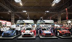 World Rally Championship drivers, co-drivers and team principals stand with their cars at the launch of the 2019 FIA World Rally Championship (WRC) at the Autosport International show held in the NEC convention centre in Birmingham, central England on January 12, 2019. (Photo by OLI SCARFF / AFP)