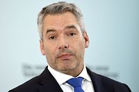 Austria's Interior Minister Karl Nehammer gives a press conference following a meeting with his conservative People's Party (OeVP) where he was named as new party head and also as Austria's new chancellor in Vienna on December 3, 2021. - Austria's ruling party named Nehammer to lead the conservative camp and the country after the shock resignation of former chancellor Sebastian Kurz as party head caused fresh political upheaval. (Photo by ROLAND SCHLAGER / APA / AFP) / Austria OUT