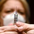 A nurse prepares a dose of the Covid-19 vaccine developed by China's Sinopharm company, at a vaccination center of a seniors club in Budapest on February 25, 2021, amid the ongoing coronavirus Covid-19 pandemic. - Hungary on February 24, 2021 became the first EU nation to start using China's coronavirus Sinopharm vaccine, Prime Minister Viktor Orban said. The country of 10 million has ordered around five million doses of the Chinese jab, and has already started inoculating its population with Russia's Sputnik V vaccine -- another EU first. (Photo by ATTILA KISBENEDEK / AFP)