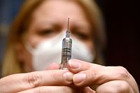 A nurse prepares a dose of the Covid-19 vaccine developed by China's Sinopharm company, at a vaccination center of a seniors club in Budapest on February 25, 2021, amid the ongoing coronavirus Covid-19 pandemic. - Hungary on February 24, 2021 became the first EU nation to start using China's coronavirus Sinopharm vaccine, Prime Minister Viktor Orban said. The country of 10 million has ordered around five million doses of the Chinese jab, and has already started inoculating its population with Russia's Sputnik V vaccine -- another EU first. (Photo by ATTILA KISBENEDEK / AFP)