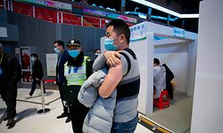 A man presses his arm after being inoculated with a Covid-19 vaccine at Jiading Stadium, a temporary vaccination site in Shanghai on January 19, 2021. (Photo by Jessica YANG / AFP)