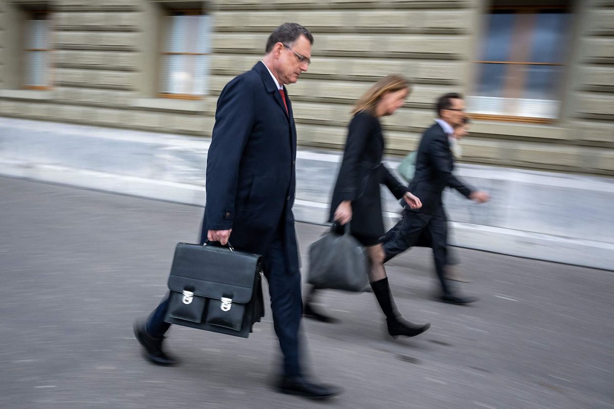 Chairman of the Swiss National Bank (SNB) Thomas Jordan (L) with his team leaves the Swiss Federal Department of Finance after talks on Credit Suisse bank crisis in Bern on 29 March, 2023