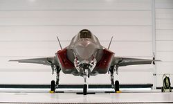 A U.S. Marine F-35B Joint Strike Fighter Jet sits in a hangar after the roll-out Ceremony at Eglin Air Force Base in Florida February 24, 2012. The B model of the new single-engine, supersonic fighter jet can take off from shorter runways and can hover and land like a helicopter, according to a military statement. REUTERS/Michael Spooneybarger (UNITED STATES - Tags: MILITARY)