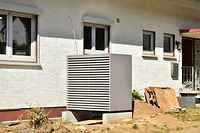 Air conditioner, Air-Air Heat Pump for Heating and hot Water in Front of an Residential Building