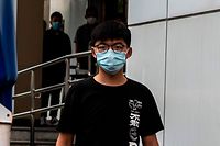 Pro-democracy activist Joshua Wong leaves Central police station in Hong Kong on September 24, 2020, after being arrested for unlawful assembly related to a 2019 protest against a government ban on face masks. (Photo by ISAAC LAWRENCE / AFP)