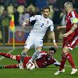 Peter Pekarik (C) of Slovakia fights for the ball with Stefano Bensi (down) and Mario Mutsch of Luxembourg during their Euro 2016 qualifying soccer match at the MSK stadium in Zilina March 27, 2015. REUTERS/Radovan Stoklasa