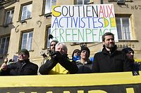 Managing director of Greenpeace France, Jean-Fran�ois Julliard (R) and Responsible for the nuclear campaign of Greenpeace, Yannick Rousselet (L) demonstrate in front of the Thionville townhall, eastern France on February 27, 2018 on the opening day of a trial of eight activists and two heads of Greenpeace France for an action carried out inside the Cattenom nuclear power plant site in October 2017. 
Charge with "intrusion as a group and with degradaing the enclosure of a civil installation sheltering nuclear materials", the militants incur five years of imprisonment and 75.000 euros of fine. General manager of Greenpeace France, Jean-Fran�ois Julliard today stated, "We take onis for this action, we know it was illegal (...) but there was a very specific reason that was to denounce the security breaches,". / AFP PHOTO / JEAN-CHRISTOPHE VERHAEGEN