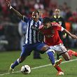 Benfica�s Maxi Pereira (R) vies for the ball with  Ricardo Quaresma from FC Porto during their Portuguese Cup second leg semi-final match held at Luz Stadium Portugal, 16 April 2014. JOSE SENA GOULAO/LUSA