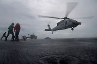 Sea Hawk helicopters attached to Carrier Strike Group 12 and the aircraft carrier USS Abraham Lincoln deployed in the Atlantic Ocean are recalled on September 15, 2018, to Naval Station Norfolk, to provide support in the aftermath of Hurricane Florence. (Photo by Jeff Sherman / Navy Office of Information / AFP) / RESTRICTED TO EDITORIAL USE - MANDATORY CREDIT "AFP PHOTO /  US NAVY / Mass Communication Specialist 3rd Class Jeff Sherman" - NO MARKETING NO ADVERTISING CAMPAIGNS - DISTRIBUTED AS A SERVICE TO CLIENTS