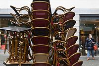 Chairs and tables of a closed restaurant are stacked together in the city of Munich, southern Germany, on March 22, 2021, amid the ongoing novel coronavirus / Covid-19 pandemic. - Germany is poised to prolong and tighten a partial lockdown into April as new virus cases soar, according to a draft document seen by AFP ahead of a strategy meeting on March 22, 2021. (Photo by Christof STACHE / AFP)