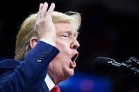 US President Donald Trump speaks during a "Keep America Great" rally at the Target Center in Minneapolis, Minnesota on October 10, 2019. (Photo by Brendan Smialowski / AFP)