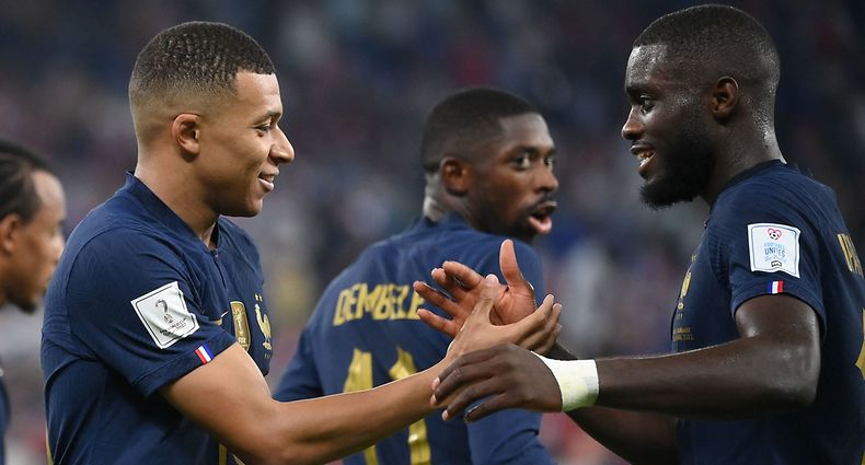 France's forward #10 Kylian Mbappe celebrates with France's defender #18 Dayot Upamecano after scoring a goal during the Qatar 2022 World Cup Group D football match between France and Denmark at Stadium 974 in Doha on November 26, 2022. (Photo by FRANCK FIFE / AFP)