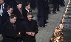 A delegation made up of heads of state and survivors including Prime Minister of Luxembourg, Xavier Bettel (L) attend a candle lighting ceremony at the former German Nazi death camp Auschwitz-Birkenau during events to commemorate the 75th anniversary of the camp's liberation in Oswiecim, Poland, on January 27, 2020. - More than 200 survivors came from across the globe to the camp the Nazis built in Oswiecim in then-occupied Poland, to share their testimony as a stark warning amid a recent surge of anti-semitic attacks on both sides of the Atlantic. (Photo by Wojtek RADWANSKI / AFP)