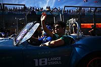 MELBOURNE, AUSTRALIA - APRIL 10: Lance Stroll of Canada and Aston Martin F1 Team waves to the crowd on the drivers parade ahead of the F1 Grand Prix of Australia at Melbourne Grand Prix Circuit on April 10, 2022 in Melbourne, Australia. (Photo by Clive Mason/Getty Images)