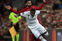 Liverpool's Egyptian striker Mohamed Salah (R) vies with Real Madrid's Austrian defender David Alaba during the UEFA Champions League last 16 first leg football match between Liverpool and Real Madrid at Anfield in Liverpool, north west England on February 21, 2023. (Photo by Paul ELLIS / AFP)