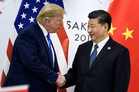 (FILES) In this file China's President Xi Jinping (R) shakes hands with US President Donald Trump before a bilateral meeting on the sidelines of the G20 Summit in Osaka on June 29, 2019. - The United States was poised Thursday to announce a historic trade deal with China, days before new tariffs are due to kick in between the world's two largest economies, easing a commercial dispute that has roiled markets for almost two years. (Photo by Brendan Smialowski / AFP)
