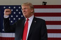 (FILES) In this file photo taken on March 13, 2018 US President Donald Trump gestures after speaking to military personnel at Marine Corps Air Station Miramar in San Diego, California.
President Donald Trump abruptly canceled his first trip to Latin America April 10, 2018, hunkering down in the White House as he faces momentous decisions about military strikes in Syria and an FBI investigation that is inching closer to the Oval Office. In a statement that surprised even some White House staff, press secretary Sarah Sanders said Trump's trip to Peru and Colombia -- set to get under way Friday -- had been scrapped.
 / AFP PHOTO / MANDEL NGAN / ALTERNATIVE CROP 