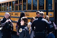 NASHVILLE, TN - MARCH 27: School buses with children arrive at Woodmont Baptist Church to be reunited with their families after a mass shooting at The Covenant School on March 27, 2023 in Nashville, Tennessee. According to initial reports, three students and three adults were killed by the shooter, a 28-year-old woman. The shooter was killed by police responding to the scene.   Seth Herald/Getty Images/AFP (Photo by Seth Herald / GETTY IMAGES NORTH AMERICA / Getty Images via AFP)