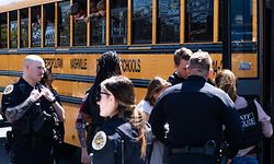 NASHVILLE, TN - MARCH 27: School buses with children arrive at Woodmont Baptist Church to be reunited with their families after a mass shooting at The Covenant School on March 27, 2023 in Nashville, Tennessee. According to initial reports, three students and three adults were killed by the shooter, a 28-year-old woman. The shooter was killed by police responding to the scene. Seth Herald/Getty Images/AFP (Photo by Seth Herald / GETTY IMAGES NORTH AMERICA / Getty Images via AFP)