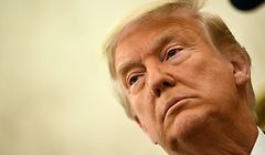 (FILES) In this file photo US President Donald Trump speaks before awarding the Presidential Medal of Freedom to retired football coach Lou Holtz on December 3, 2020, in the Oval Office of the White House in Washington, DC. - President Donald Trump plans to issue a decree on December 8, 2020 aimed at granting Americans priority access to certain vaccines, but faced questions over whether the White House missed an opportunity to shore up sufficient doses in the months ahead. President-elect Joe Biden will meanwhile announce his appointments and nominations for his health team as he continues to push ahead with the transition process despite Trump's refusal to concede. (Photo by Brendan Smialowski / AFP)