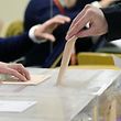 A man casts his vote at the Volturno Cultural Centre in Pozuelo de Alarcon on the outskirts of Madrid on December 20, 2015. Spaniards go to the polls today in what is expected to be one of the most closely-fought contests in modern history, as two dynamic new parties take on the country's long-established giants. AFP PHOTO / JAVIER SORIANO