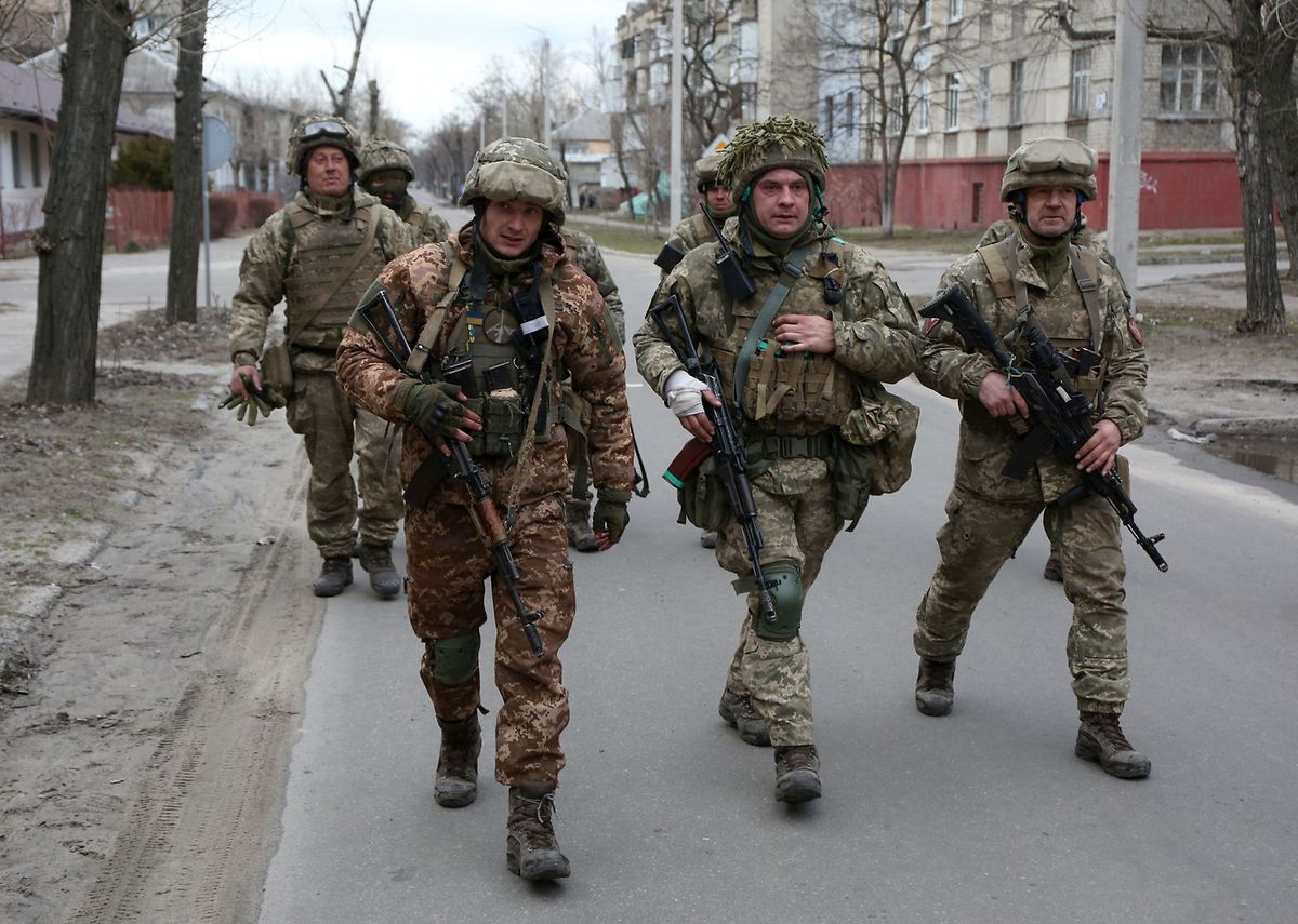 Servicemen of Ukrainian Military Forces walk in the small town of Sievierodonetsk, Lugansk Oblast, on Sunday.