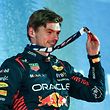 Dutch driver Max Verstappen of Red Bull Racing holds a medal on the podium after winning the Bahrain Formula 1 Grand Prix at the Bahrain International Circuit in Sakhir on March 5, 2023.  (Photo by Giuseppe CACACE / AFP)