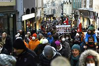Demonstrators protest against the government's coronavirus measures on November 27, 2021 in Graz, Austria, amid the novel coronavirus / Covid-19 pandemic. - Tens of thousands of Austrians rallied this weekend to protest against the government's introduction of compulsory vaccination -- the first EU country to do so -- as the chancellor insisted on November 28, 2021 that the move would represent "a minor interference" compared to the alternatives. (Photo by ERWIN SCHERIAU / APA / AFP) / Austria OUT
