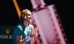 Greece's Stefanos Tsitsipas celebrates his victory against Spain's Roberto Bautista Agut during their men's singles quarter-final match on day nine of the Australian Open tennis tournament in Melbourne on January 22, 2019. (Photo by William WEST / AFP) / -- IMAGE RESTRICTED TO EDITORIAL USE - STRICTLY NO COMMERCIAL USE --