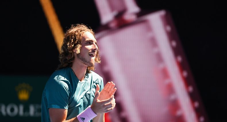 Greece's Stefanos Tsitsipas celebrates his victory against Spain's Roberto Bautista Agut during their men's singles quarter-final match on day nine of the Australian Open tennis tournament in Melbourne on January 22, 2019. (Photo by William WEST / AFP) / -- IMAGE RESTRICTED TO EDITORIAL USE - STRICTLY NO COMMERCIAL USE --