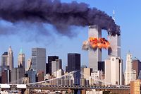FIFTH IN A PACKAGE OF NINE PHOTOS.-- An explosion rips through the  South Tower of the World Trade Towers after the hijacked United Airlines Flight 175, which departed from Boston en route for Los Angeles, crashed into it Sept, 11, 2001. The North Tower is shown burning after American Airlines Flight 11 crashed into the tower at 8:45 a.m. (AP Photo/Aurora, Robert Clark)