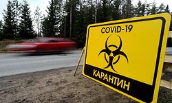 A sign reading "Quarantine COVID-19" is pictured at the entrance to the village of Pervomaiskoye outside Saint Petersburg on May 3, 2020 amid the coronavirus pandemic. - Entry into the settlement has been prohibited since April 30 as the rate of virus infection is 2.5 times higher than in Leningrad region. (Photo by Olga MALTSEVA / AFP)