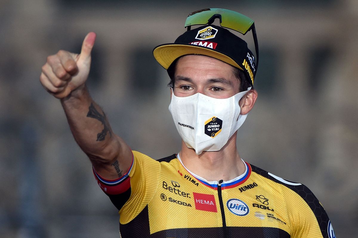 Team Jumbo's Slovenian rider Primoz Roglic celebrates winning the 2021 La Vuelta cycling tour of Spain after the 21st and final stage, a 33.8 km time-trial from Padron to Santiago de Compostela, on September 5, 2021. (Photo by MIGUEL RIOPA / AFP)
