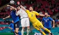 TOPSHOT - (L to R) Italy's defender Leonardo Bonucci, Spain's forward Alvaro Morata and Italy's goalkeeper Gianluigi Donnarumma vie for the ball during the UEFA EURO 2020 semi-final football match between Italy and Spain at Wembley Stadium in London on July 6, 2021. (Photo by Frank Augstein / POOL / AFP)