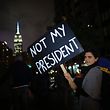 TOPSHOT - A woman takes part during a protest against President-elect Donald Trump in New York City on November 9, 2016. / AFP PHOTO / KENA BETANCUR