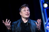 (FILES) In this file photo taken on April 11, 2022, Elon Musk, founder of SpaceX, speaks during the Satellite 2020 at the Washington Convention Center in Washington, DC. - Elon Musk said on May 13, 2022  he was putting a temporary halt on his much-anticipated deal to buy Twitter, sending shares in the social media giant plunging. (Photo by Brendan Smialowski / AFP)
