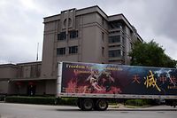 A truck drives past the Chinese consulate in Houston on July 24, 2020, after the US State Department ordered China to close the consulate. - The US ordered China to close its Houston consulate, Beijing said on July 22, in what it called a "political provocation" that will further harm diplomatic relations. (Photo by Mark Felix / AFP)