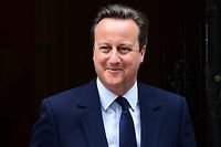 British Prime Minister David Cameron reacts as he departs 10 Downing Street enroute to the Houses of Parliament in central London on June 27, 2016.
The British government on Monday agreed to establish a new civil service unit that will have the complex task of negotiating the country's departure from the European Union, outgoing Prime Minister David Cameron's spokeswoman said. London stocks extended their losses in early afternoon Monday, led by banking, airline and property shares, following Britain's vote to leave the EU. / AFP PHOTO / LEON NEAL